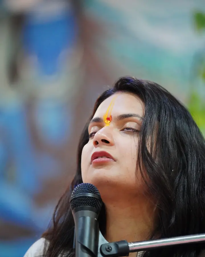 Dr. Sonali Mishra leading practice, eyes closed
